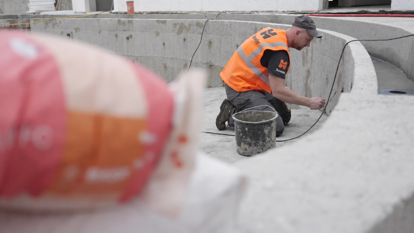 Manual preparation of the detail at the junction between the basin wall and floor.